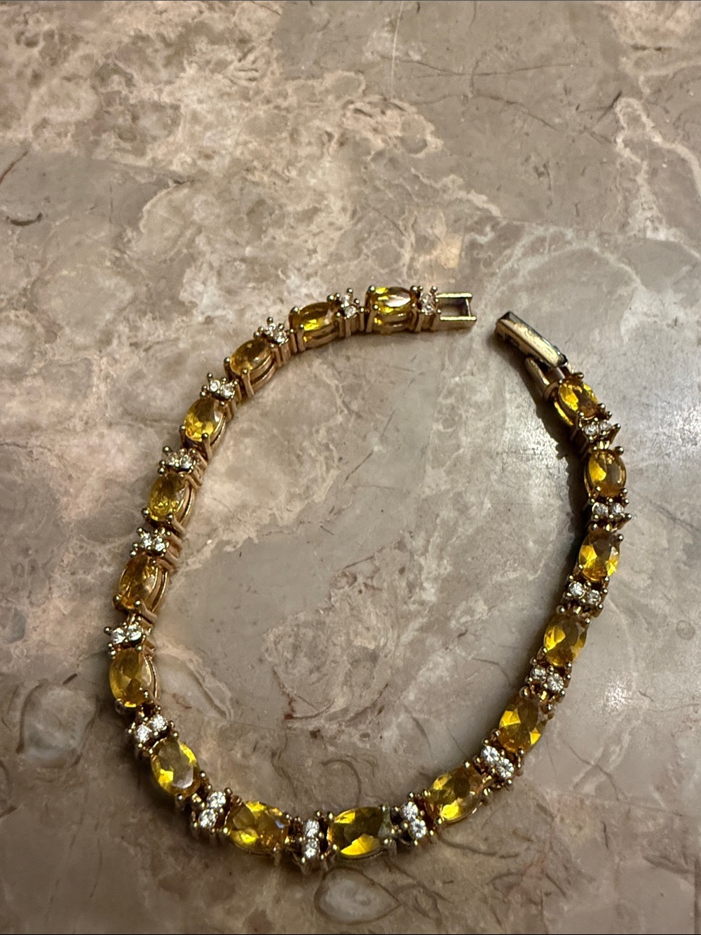 Vintage Avon, white and topaz colored stone, tennis bracelet gold tone